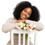 Black Woman Leaning on Chair with Tulip Bouquet Transparent Background