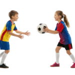 Boy and Girl Playing Soccer Passing Football Ball
