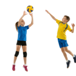 Boy and Girl Playing Volleyball Jumping to Hit Ball