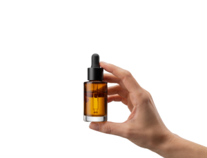Hand Holding Essential Oil Dropper Bottle Isolated