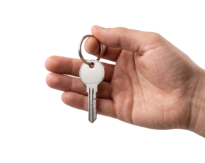 Hand Holding Metal House Key Ring Isolated