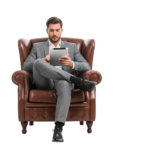 Senior Businessman Sitting in Vintage Leather Armchair Holding Digital Tablet