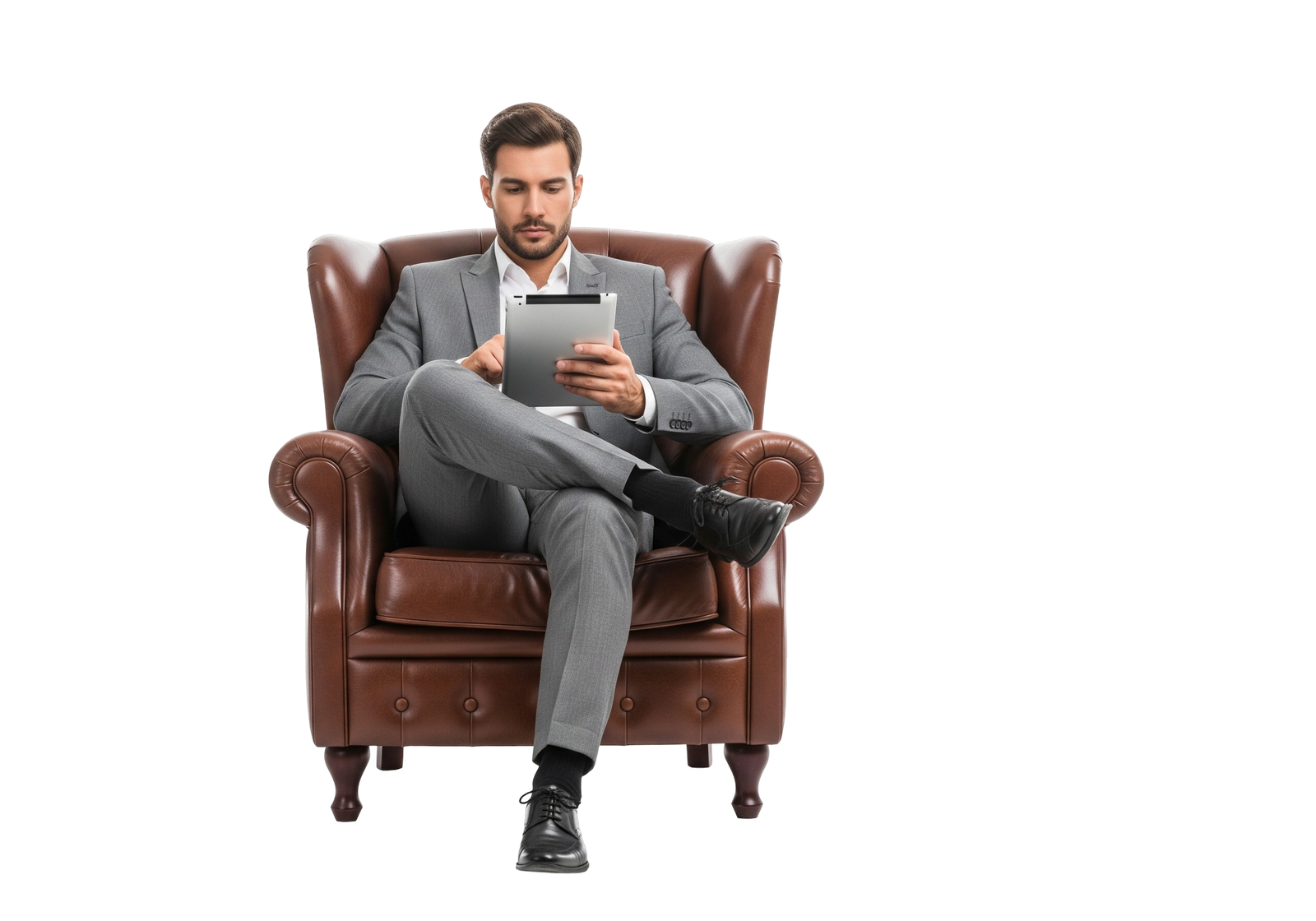 Senior Businessman Sitting in Vintage Leather Armchair Holding Digital Tablet