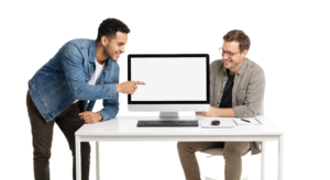 Two Men Collaborating on a Computer with Blank Screen