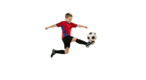Young Boy Soccer Player Kicking Ball Flying in Air Action Shot