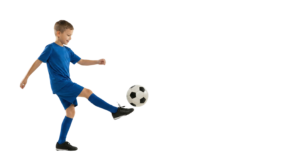 Young Boy Soccer Player Kicking Football Ball Action