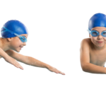 Young Boys Swimming in Pool Wearing Goggles and Cap